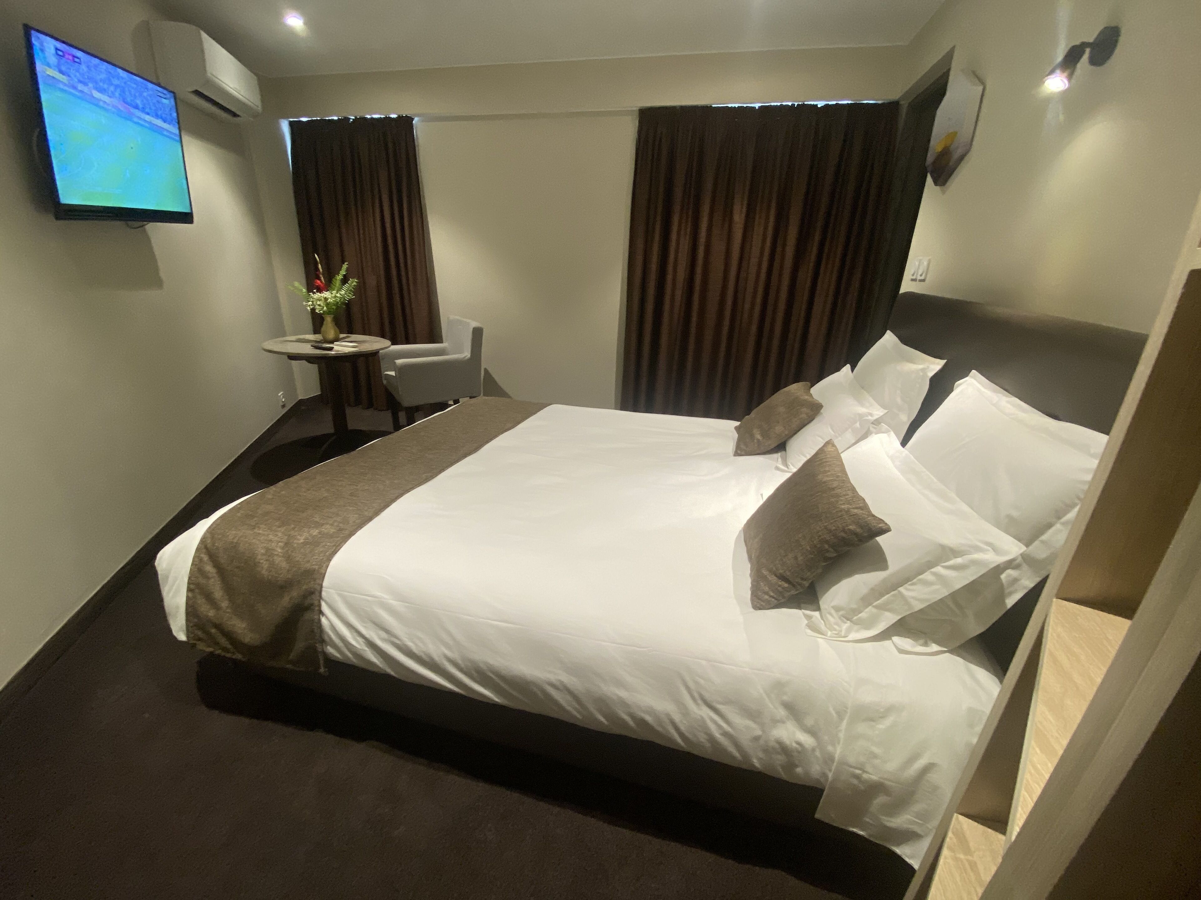 minibar, laptop workspace, blackout curtains, soundproofing