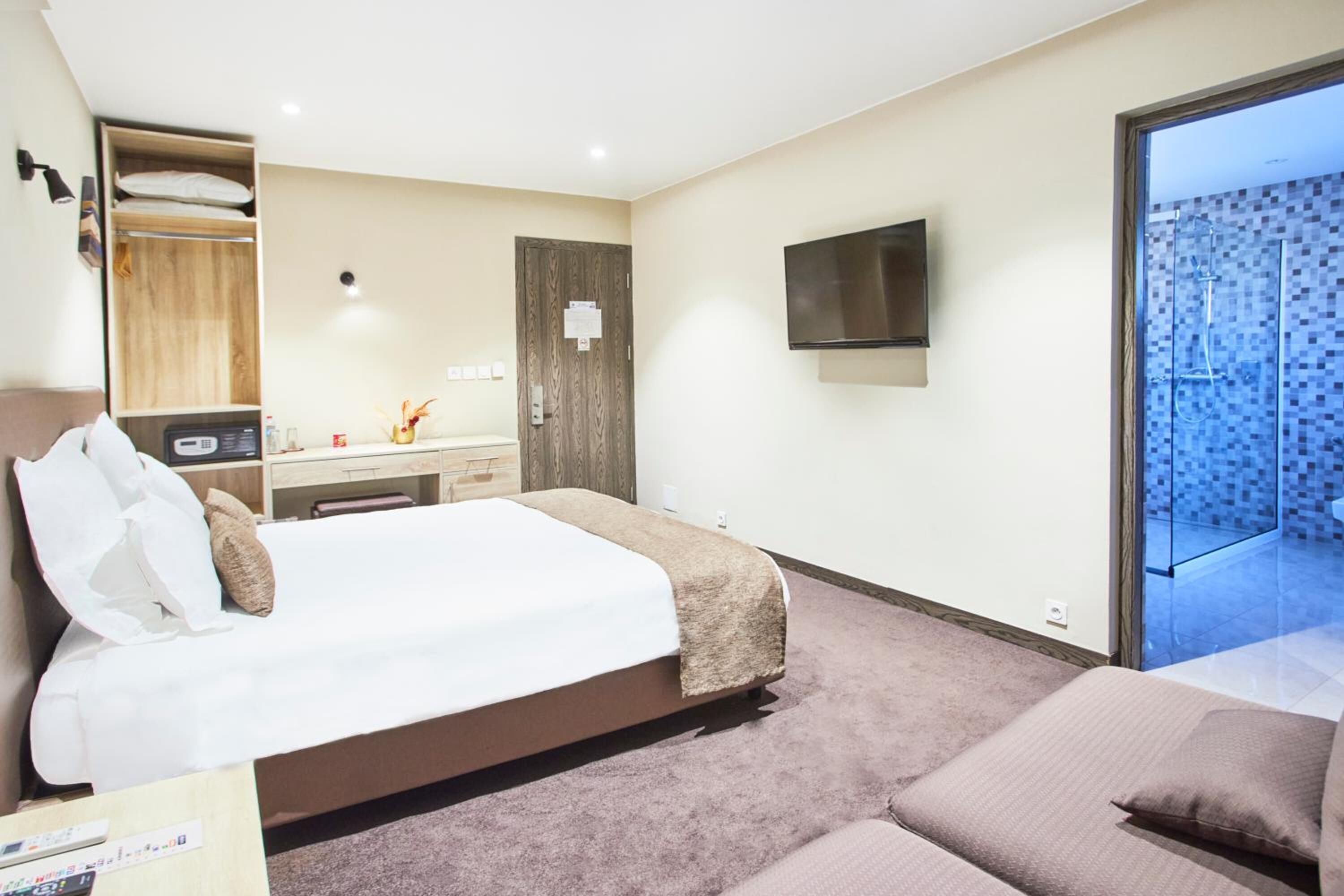 minibar, laptop workspace, blackout curtains, soundproofing