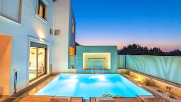 Outdoor pool, a heated pool, sun loungers
