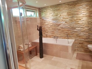 Bathtub, hair dryer, towels, soap
