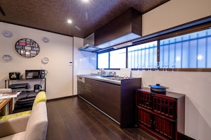 Enjoy cooking in this well-equipped kitchen with oven, microwave, and sink.