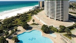 A resort with a large pool, beachfront view, and a tall building. - MAKE OFFER JULY 5-10 Stunning Gulf Views, 3 Bed 3 Bath Silver Shells Resort (Destin)