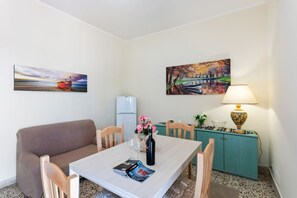 Dining - GuestHost - This comfortable 80sqm apartment can accommodate up to 3 people (distributed over 2 levels with internal stairs) located on the first floor, without a lift, of a characteristic building overlooking the Cyclops Riviera and Lachea Island. In 5  (Aci Trezza)