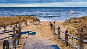 A beach path leading to the ocean with a sign warning to keep off the dunes. - Waterfront amazing views near beaches! (Eastham)