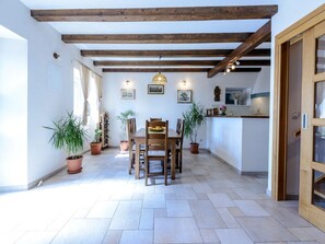 Enjoy meals in the open-plan living space with a dining area and kitchen.