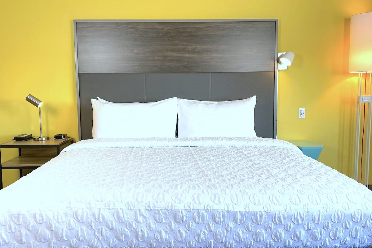 hypo-allergenic bedding, desk, laptop workspace, blackout curtains
