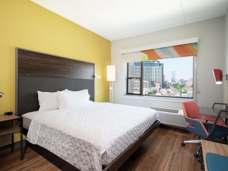 Hypo-allergenic bedding, desk, laptop workspace, blackout curtains