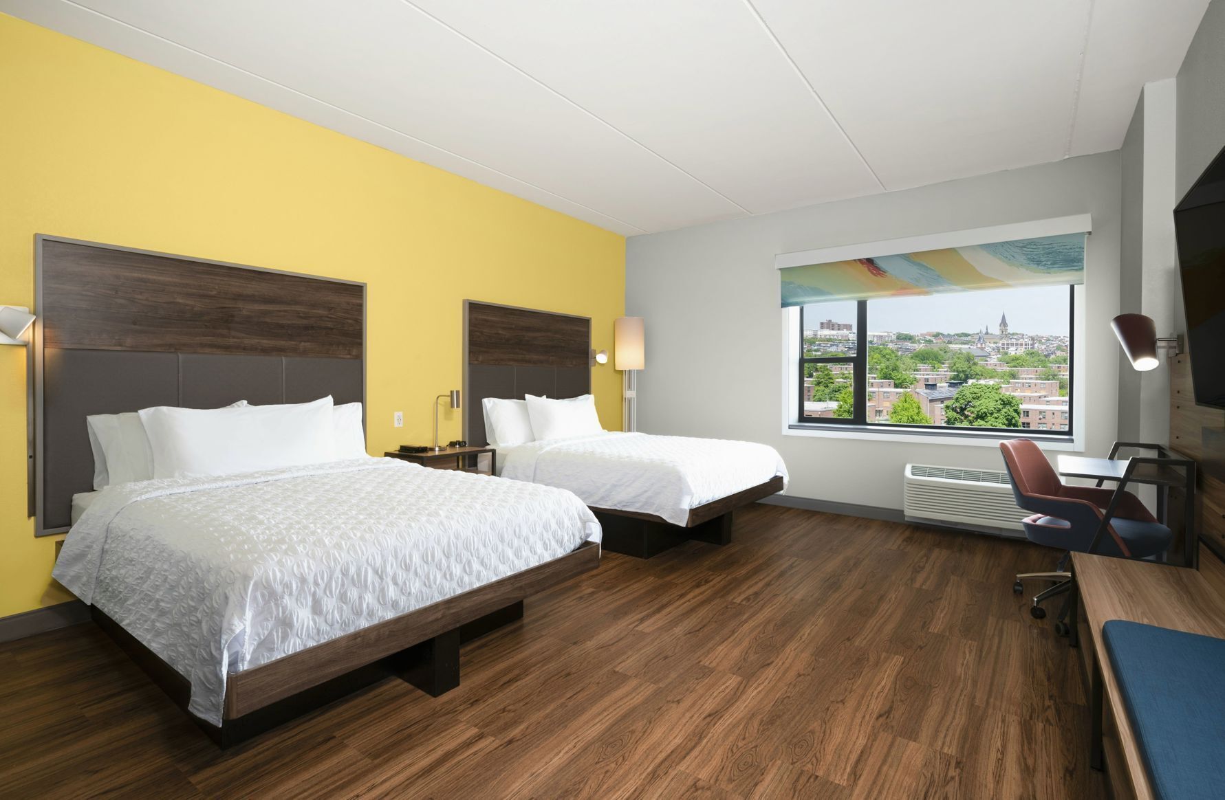 Hypo-allergenic bedding, desk, laptop workspace, blackout drapes