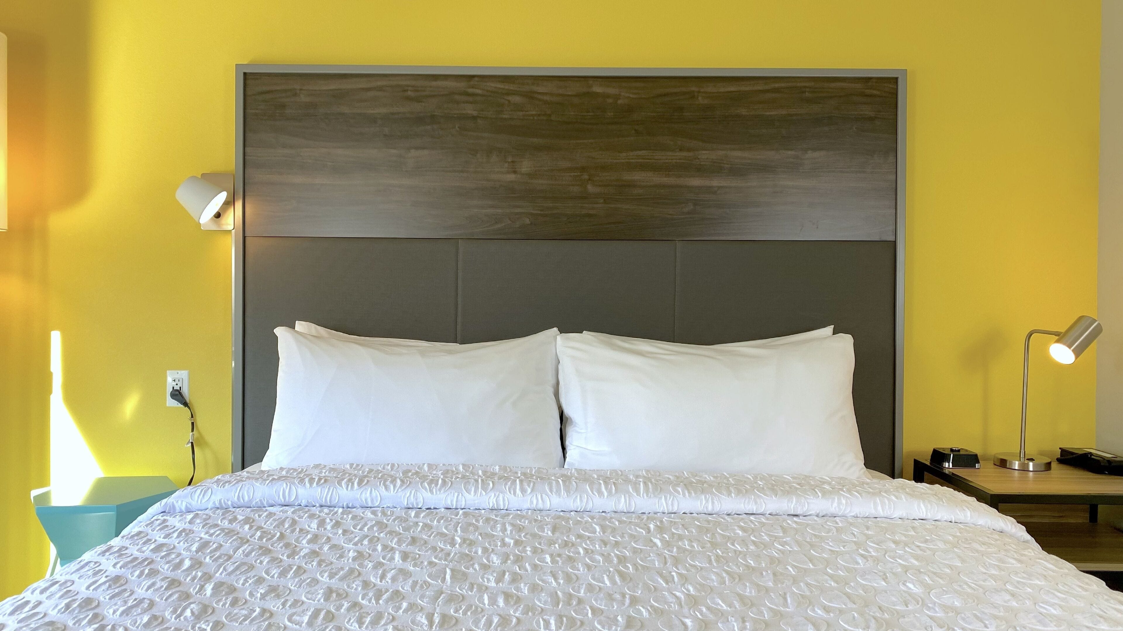 hypo-allergenic bedding, desk, laptop workspace, blackout curtains