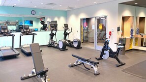 A gym with treadmills, stationary bikes, and weight machines. - Tru By Hilton Baltimore Harbor East, MD (Baltimore)