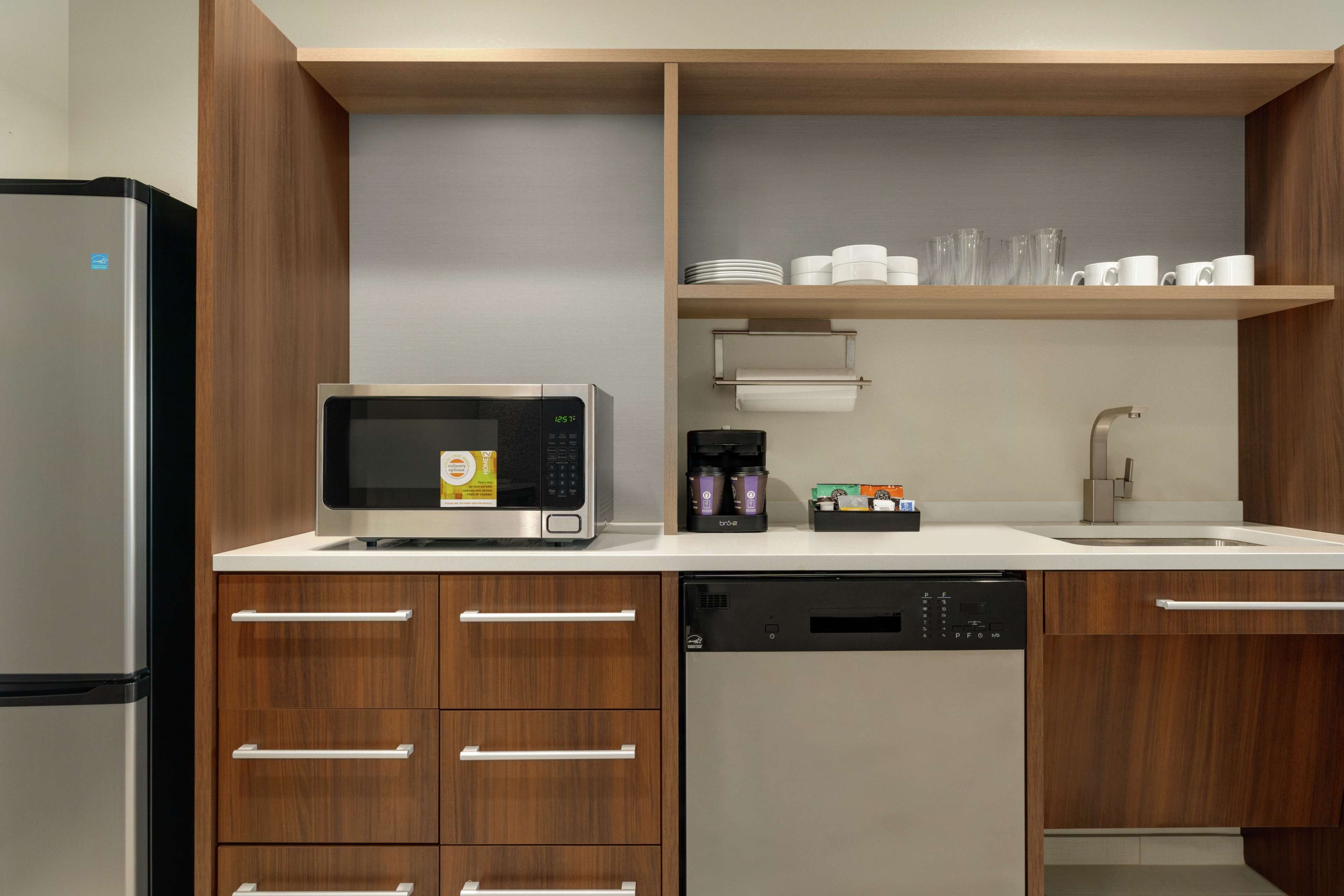 full-sized fridge, microwave, dishwasher, coffee/tea maker