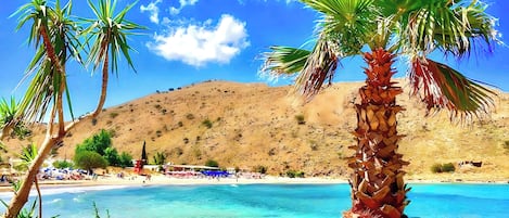 On the beach, sun-loungers, beach towels