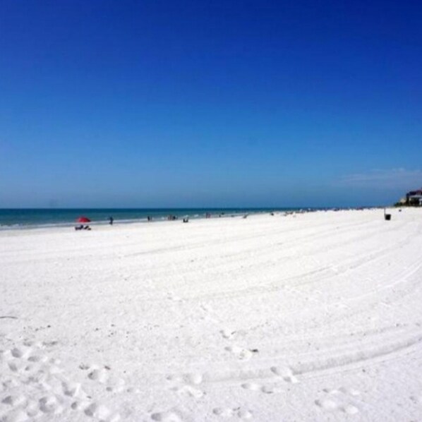 On the beach, sun loungers, beach towels