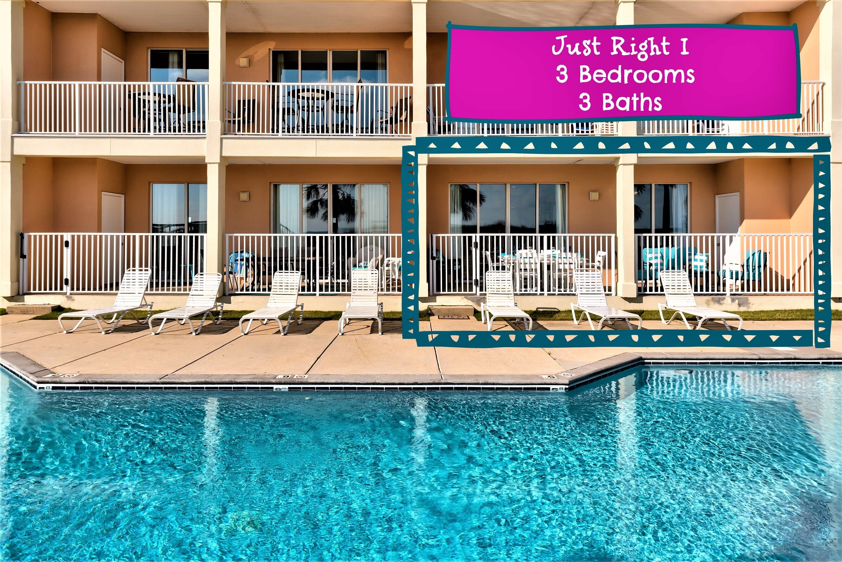 A hotel with a pool area, balconies, and a sign indicating 3 bedrooms and 3 baths.