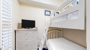 Cozy retreat with a bunk bed and TV for a comfortable stay.