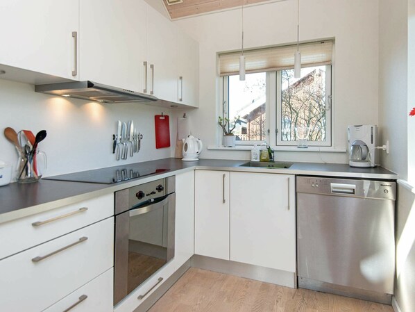 Fridge, stovetop, dishwasher, coffee/tea maker
