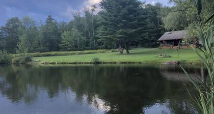Rustic escape on a pond with 7 acres in Colebrook, CT!