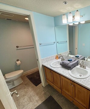 Combined shower/tub, hair dryer, towels, soap
