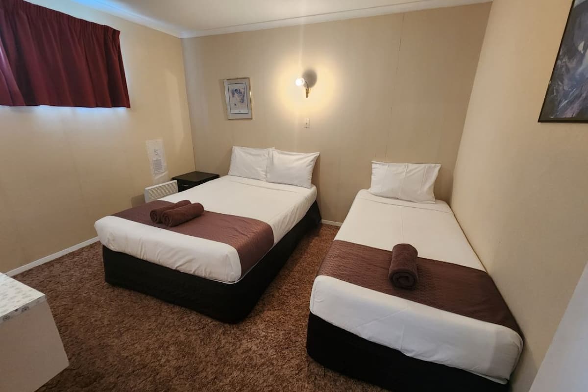 Family Room | Minibar, blackout drapes, free WiFi, bed sheets