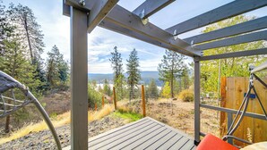 A wooden deck with a view of a forest and a body of water. - The Overlook Gem: Stunning Views & Serenity Awaits (Nine Mile Falls)