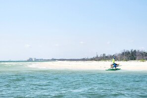 On the beach, windsurfing, kayaking, motor boating