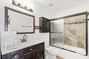Bathtub, hair dryer, towels
