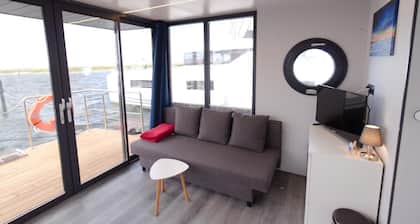 Houseboat Fjord Aquila with roof terrace in Wendtorf