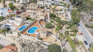 A residential area with multiple houses, a swimming pool, and a road. - Luxury villa with sea view, with Swimming pool (Campello)