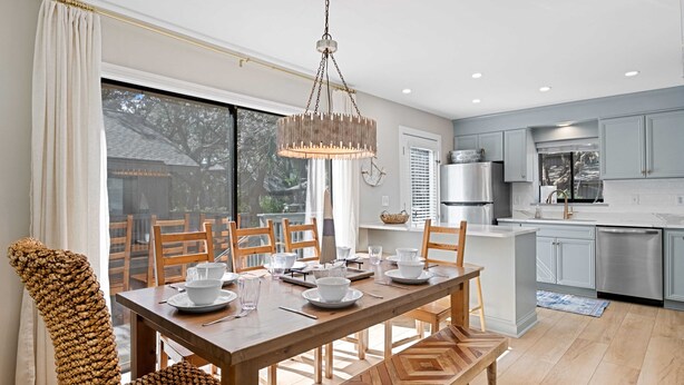 A modern kitchen with a dining area. - Newly Renovated Luxury Villa- 5 minute walk to Beach! (Hilton Head Island)