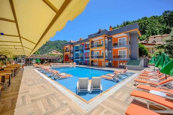 Seasonal outdoor pool, open 8:00 AM to 7:00 PM, free pool cabanas