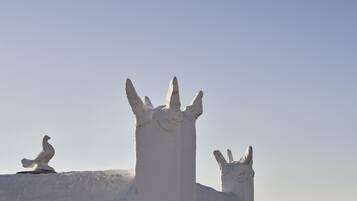 A white building with a unique architectural feature resembling a crown or a spire.