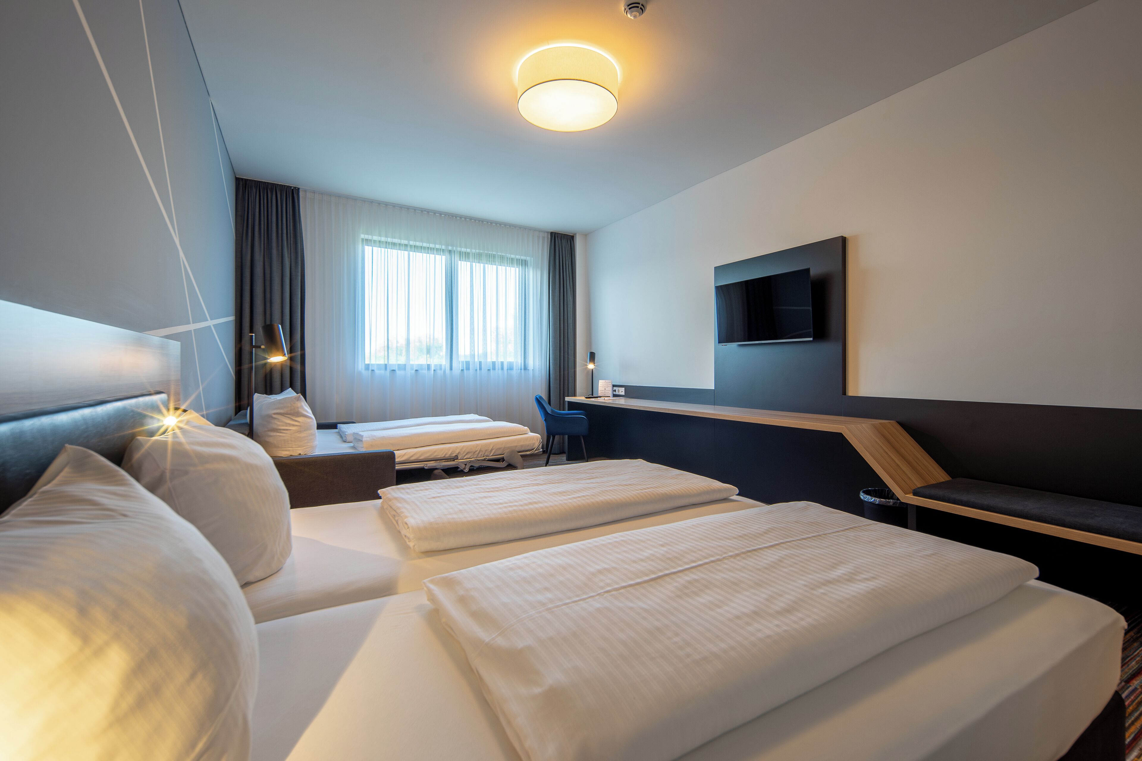 family double room | in-room safe, desk, blackout curtains, soundproofing