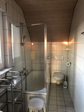 Bathtub, hair dryer, towels, soap