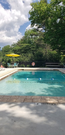 Seasonal outdoor pool, open 10:00 AM to 8:00 PM, pool umbrellas