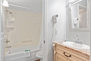 Bathtub, hair dryer, towels