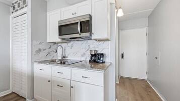 Fridge, microwave, stovetop, coffee/tea maker