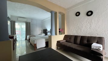 Standard Suite, Multiple Beds, Non Smoking, Balcony | Living area | 32-inch Smart TV with digital channels