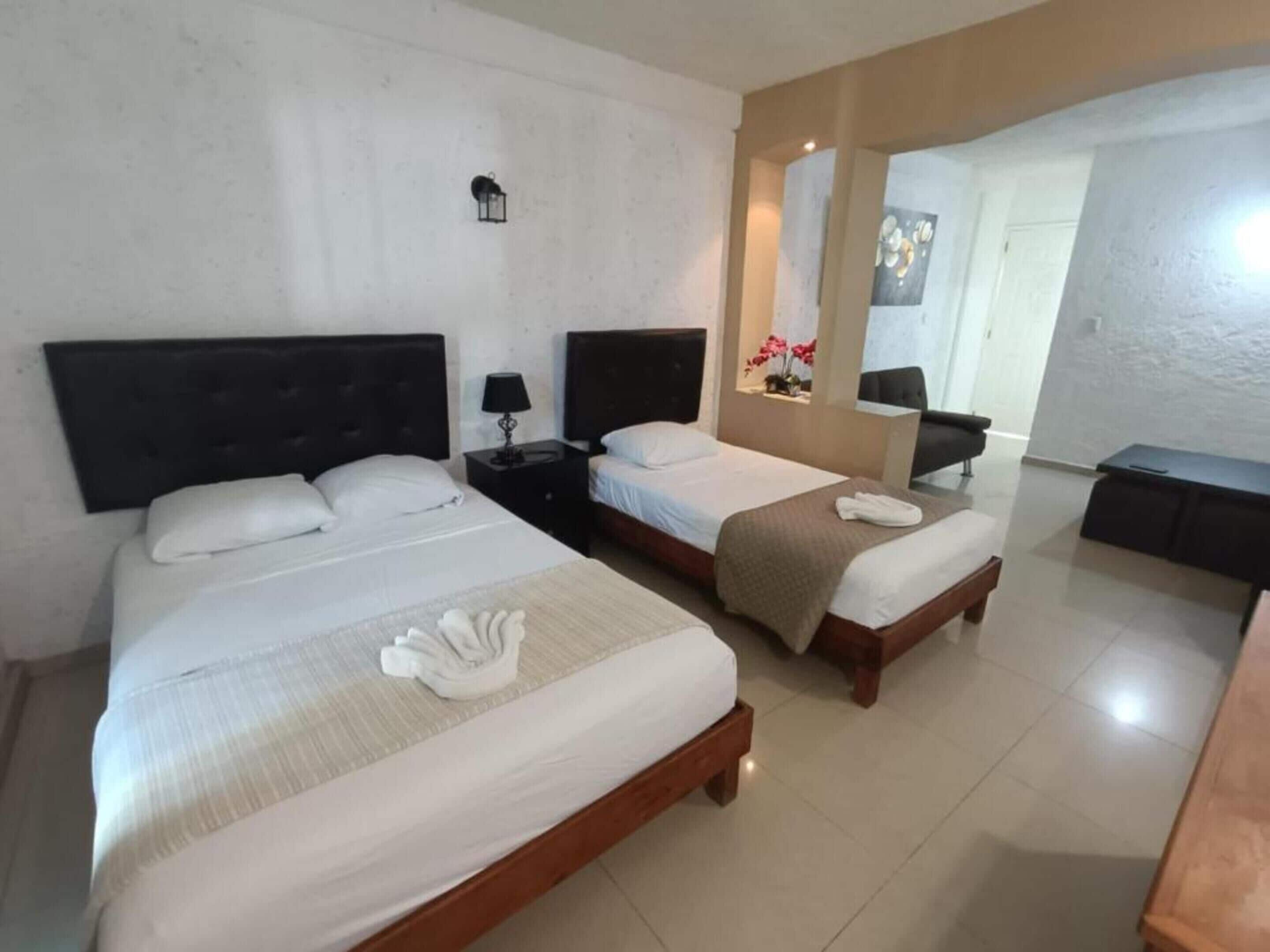 Standard Suite, Multiple Beds, Non Smoking, Balcony | Free WiFi, bed sheets