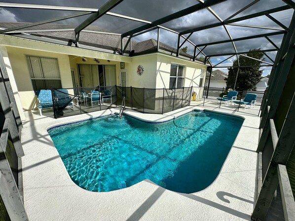A heated pool, sun loungers