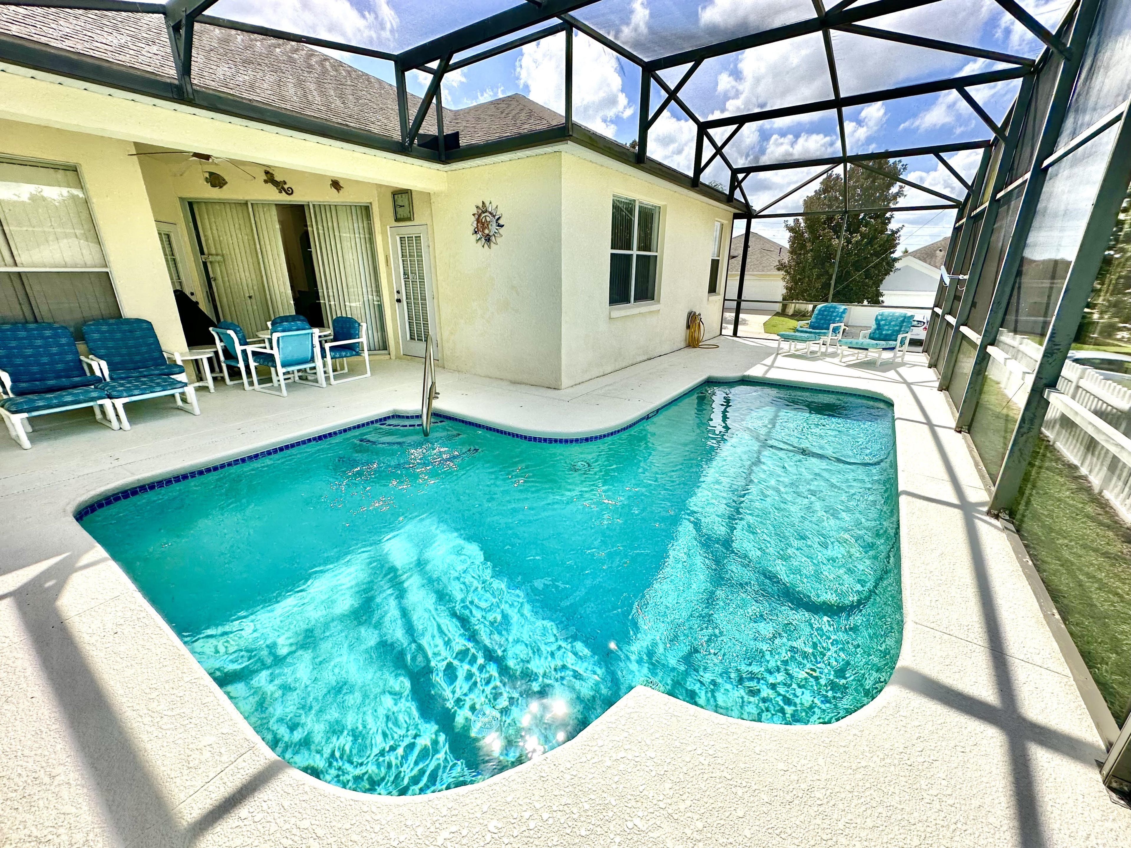 A heated pool, sun loungers