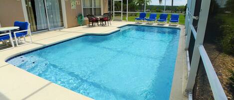 A heated pool, sun loungers
