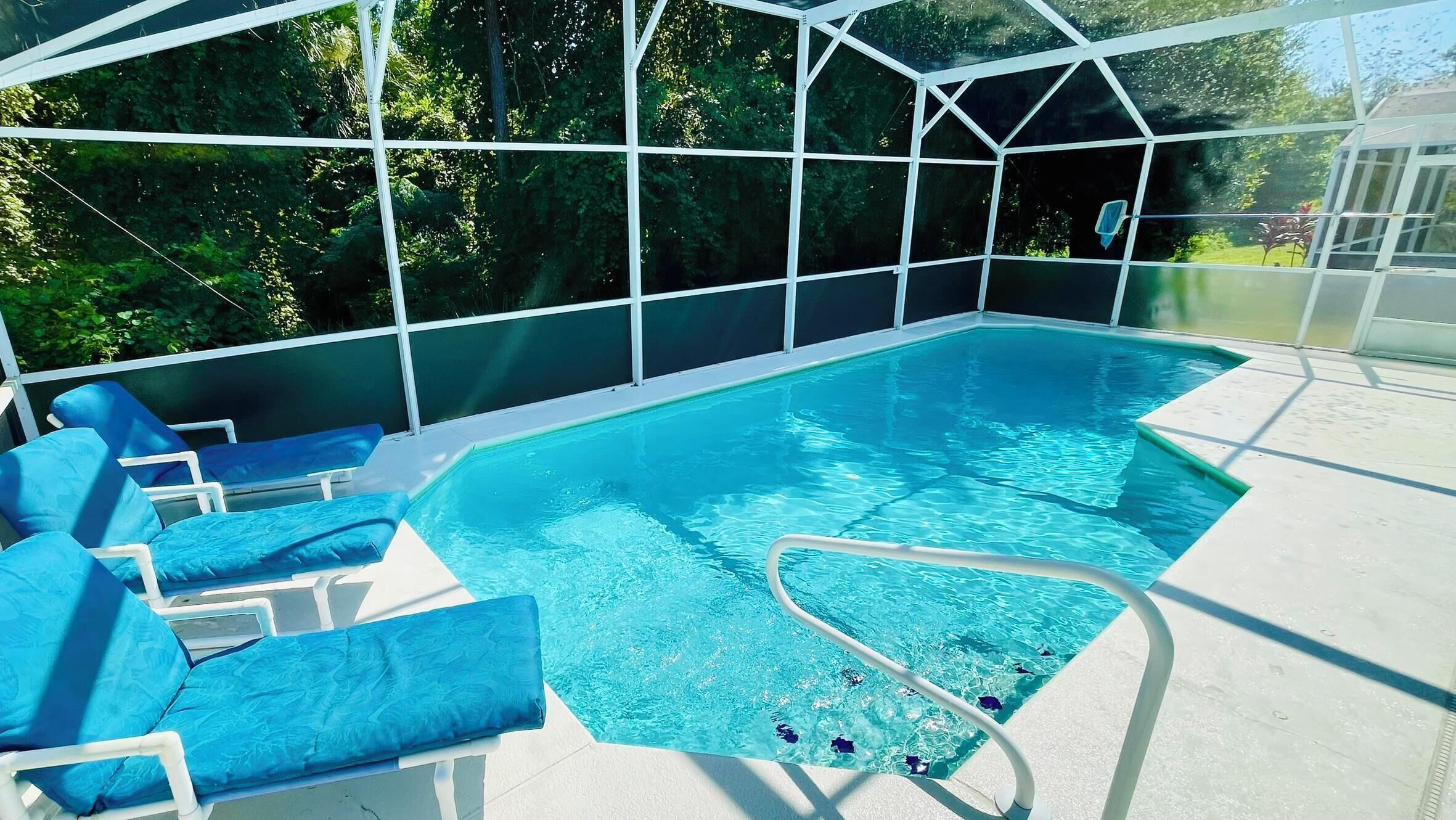 A heated pool, sun loungers