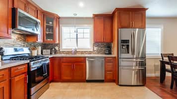Fridge, microwave, cookware/dishes/utensils, dining tables