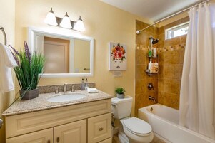Combined shower/bathtub, towels, soap, shampoo