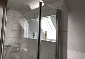 Shower, hair dryer, towels, soap