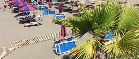 Private beach, black sand, sun-loungers, beach umbrellas