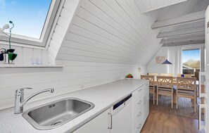 Fridge, stovetop, dishwasher, coffee/tea maker