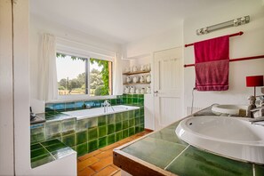Bathtub, hair dryer, towels, soap