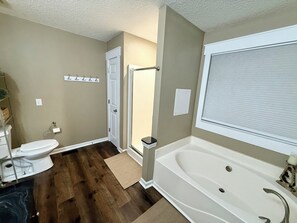 Bathtub, hair dryer, towels, soap