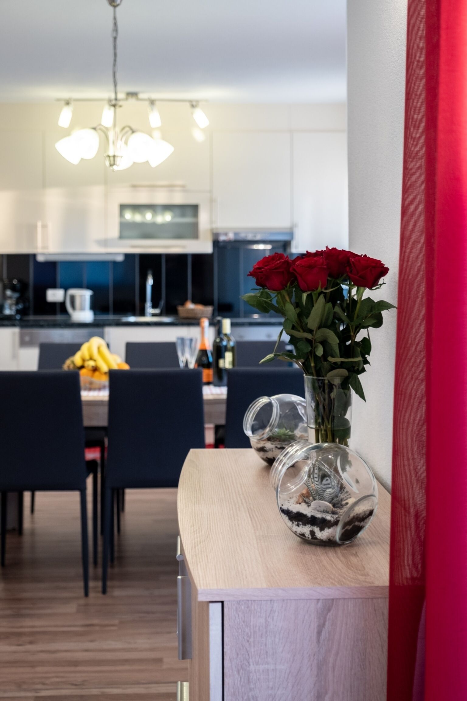 A modern kitchen with a dining area.